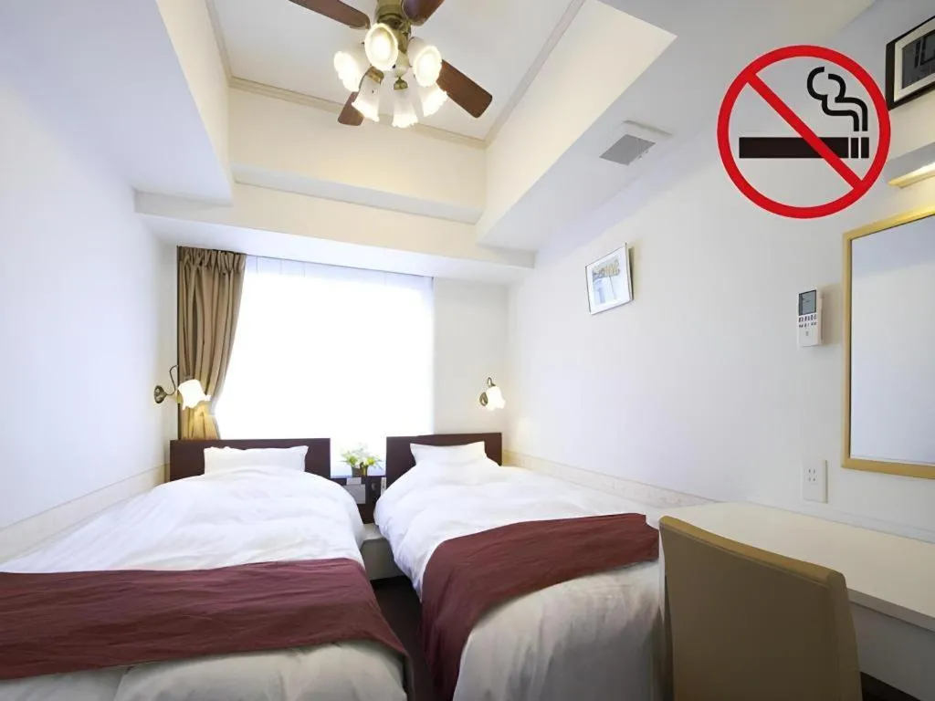 Bed in Hotel Shimbashi Sambankan