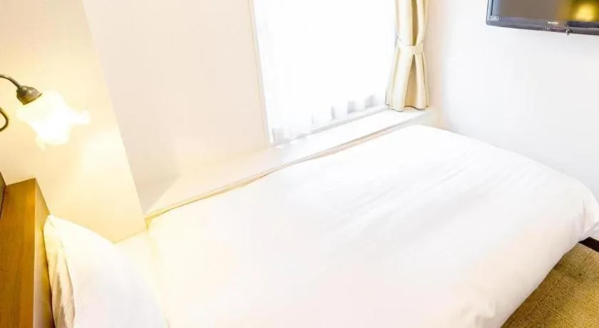 Bed in Hotel Shimbashi Sambankan