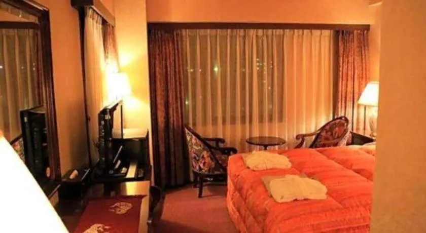 Bed in Palace Inn Toyota