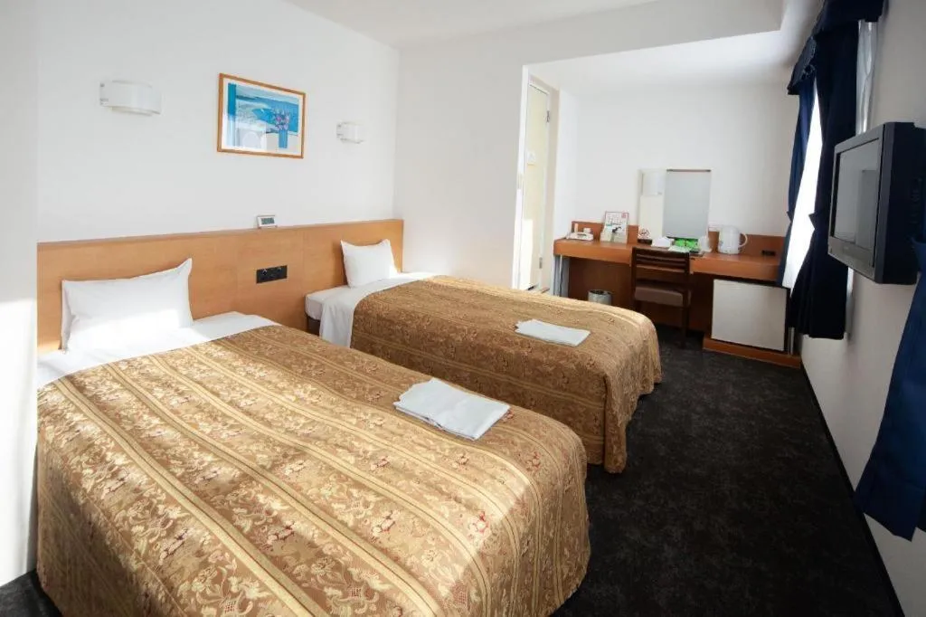 Bed in Hirata Maple Hotel