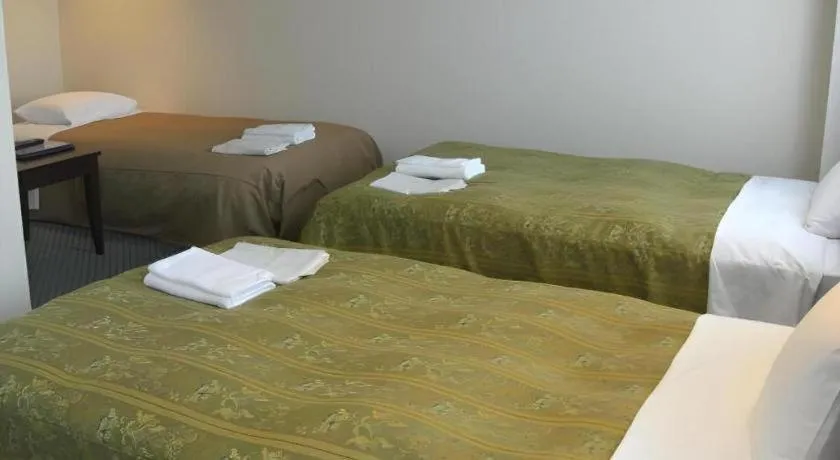 Bed in Hirata Maple Hotel