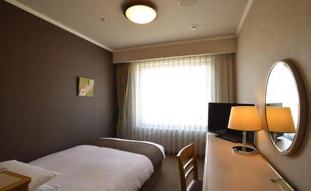 Bed in Green Hill Hotel Onomichi