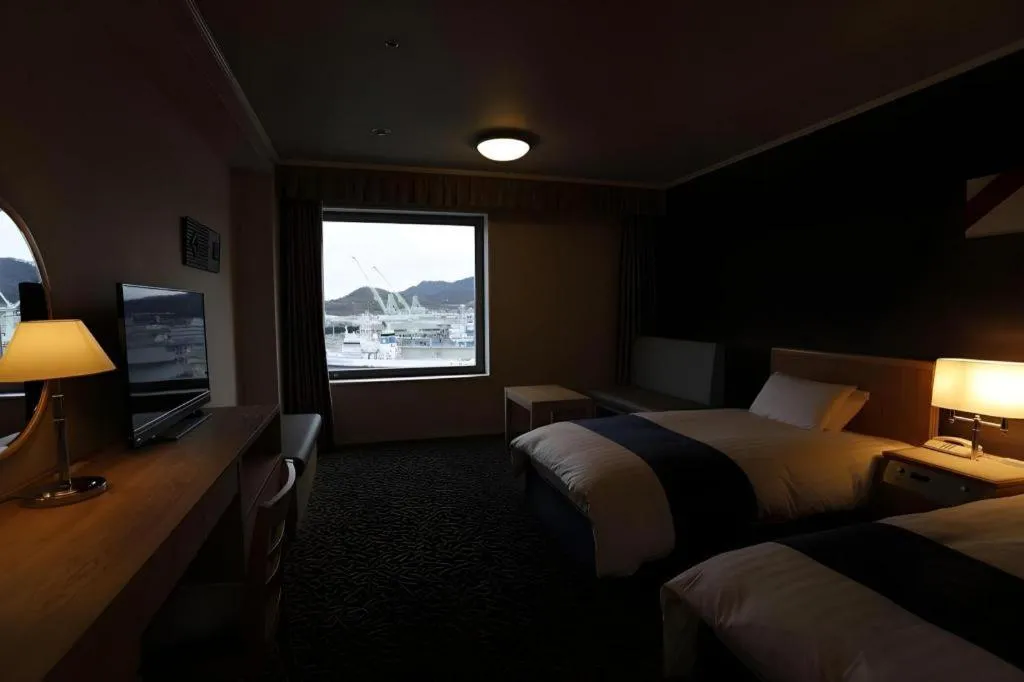 Bed in Green Hill Hotel Onomichi