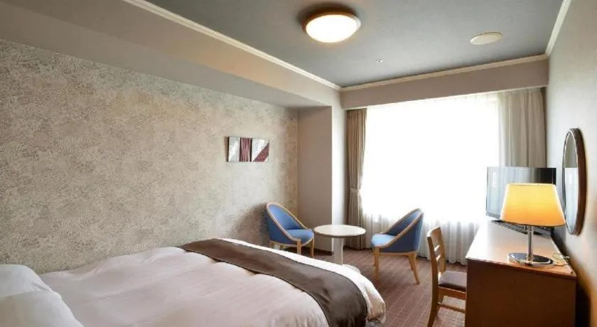 Bed in Green Hill Hotel Onomichi