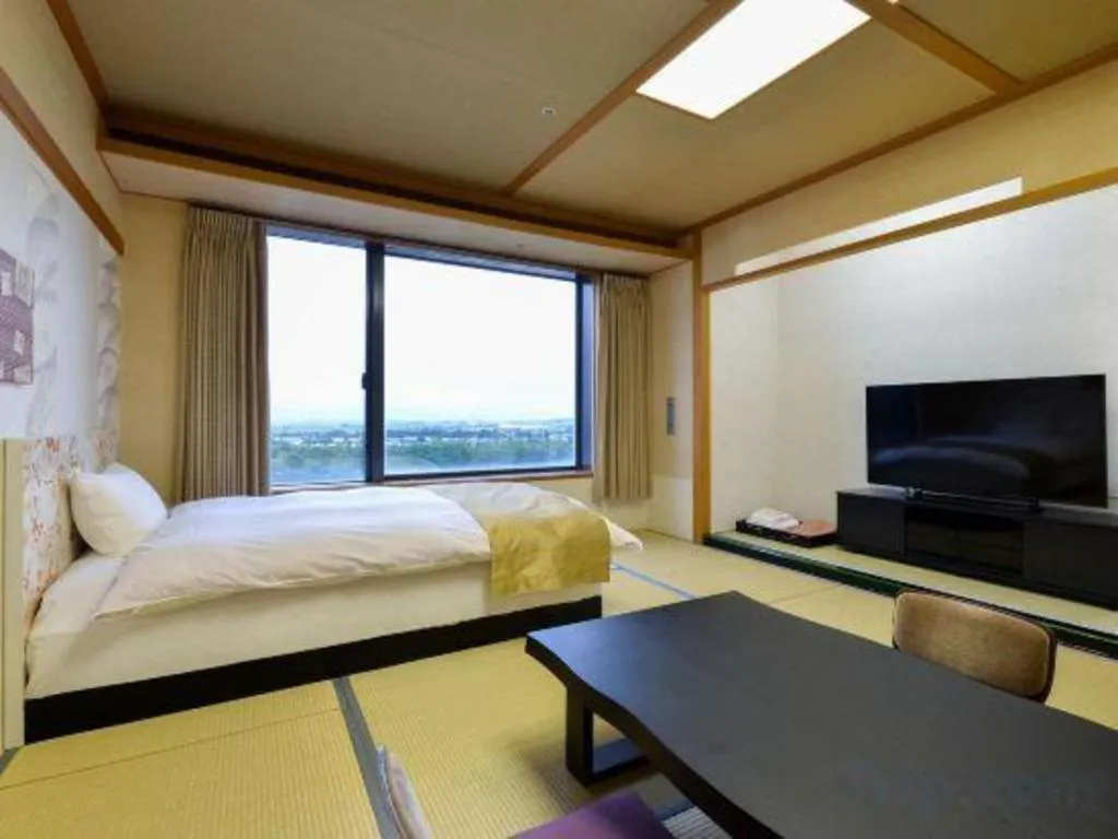 Bed in Centurion Hotel Technoport Fukui- Artificial Radium Hot Spring