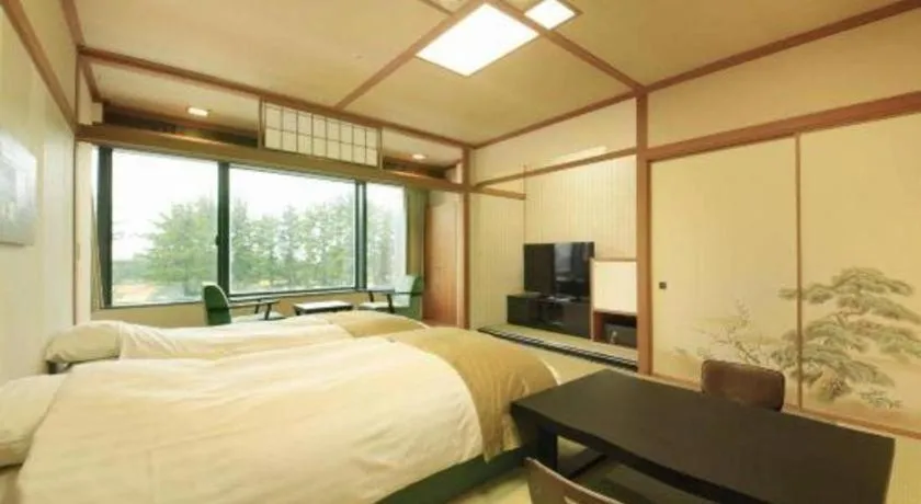 Bed in Centurion Hotel Technoport Fukui- Artificial Radium Hot Spring