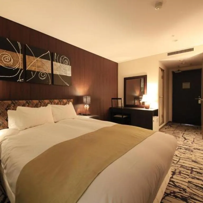 Bed in Centurion Hotel Technoport Fukui- Artificial Radium Hot Spring