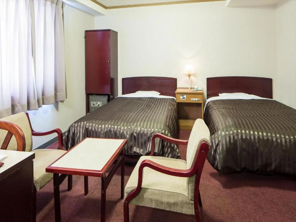 Bed in Ichimanri Hotel Golden Century