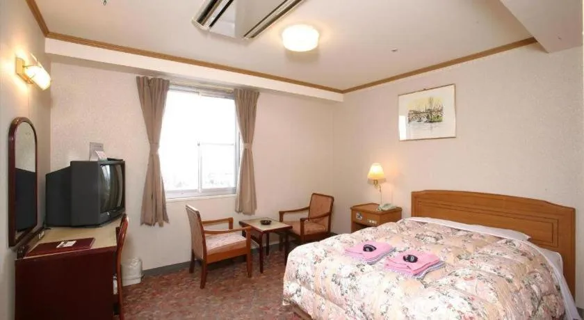 Bed in Ichimanri Hotel Golden Century