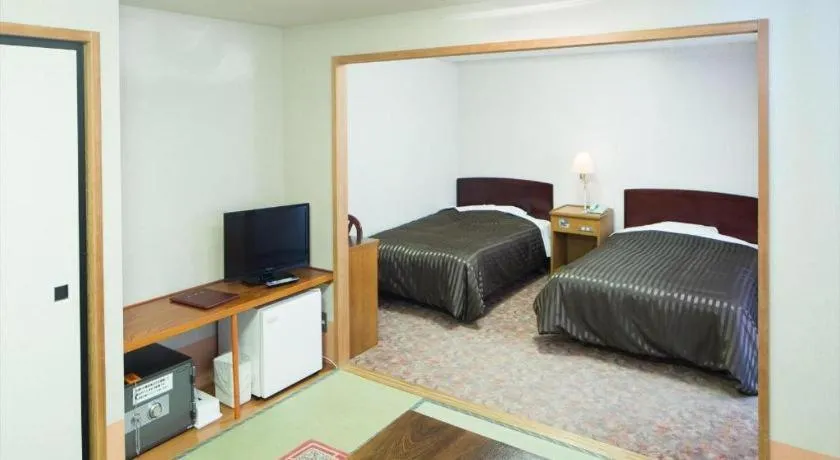 Bed in Ichimanri Hotel Golden Century