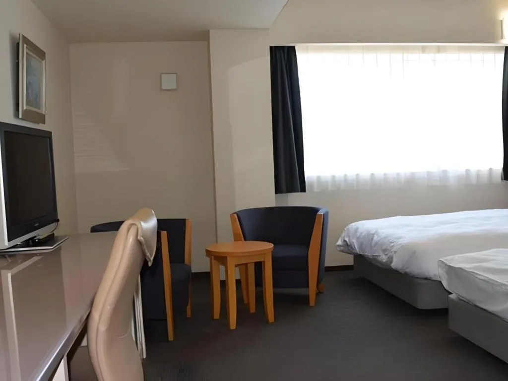 Bed in Shiroko Storia Hotel