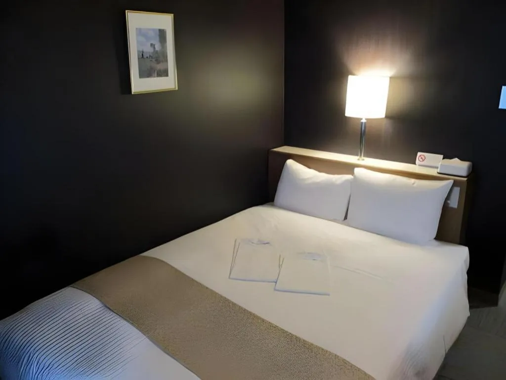 Bed in Niigata Keihin Hotel