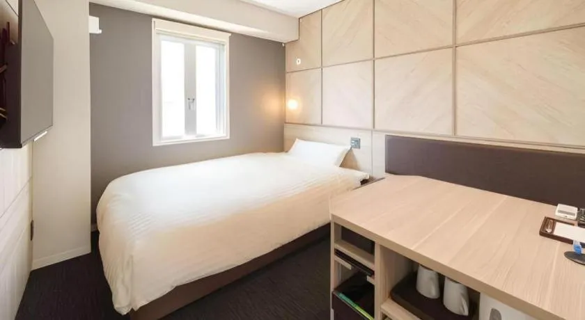 Bed in Super Hotel Satsuma Sendai