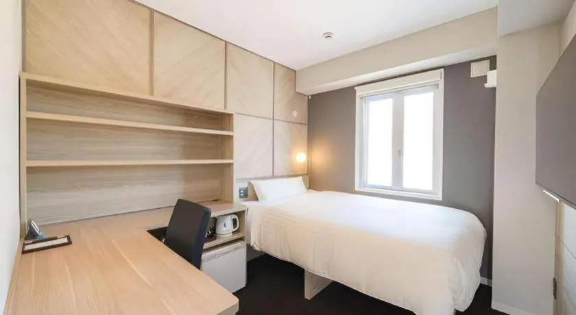 Bed in Super Hotel Satsuma Sendai