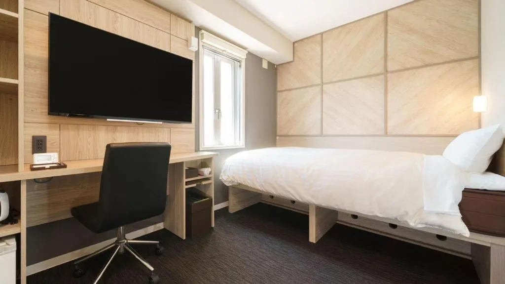 Bed in Super Hotel Satsuma Sendai