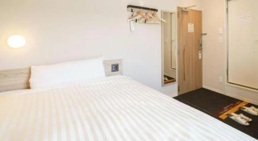 Bed in Super Hotel Satsuma Sendai