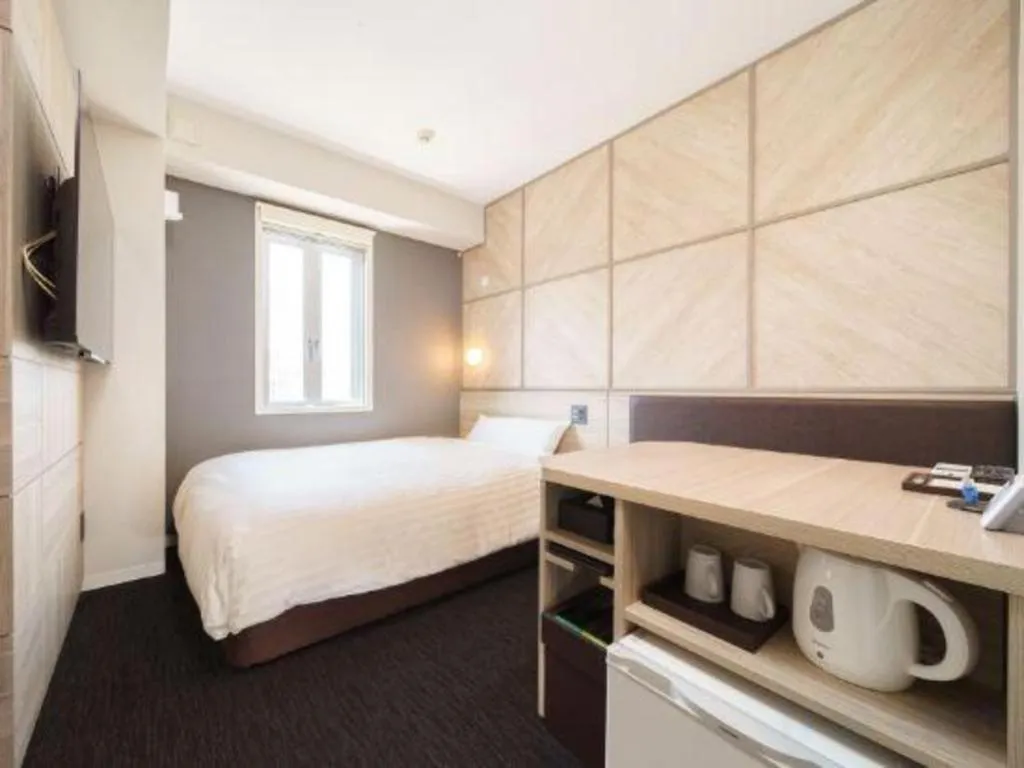 Bed in Super Hotel Satsuma Sendai