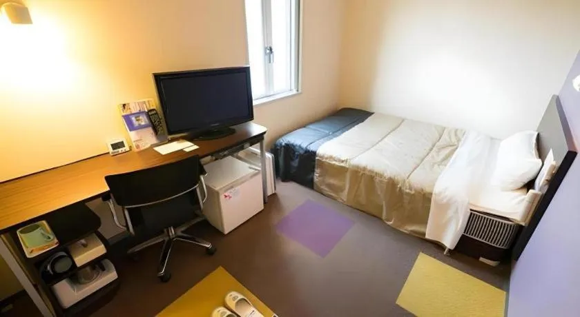 Bed in Super Hotel Satsuma Sendai