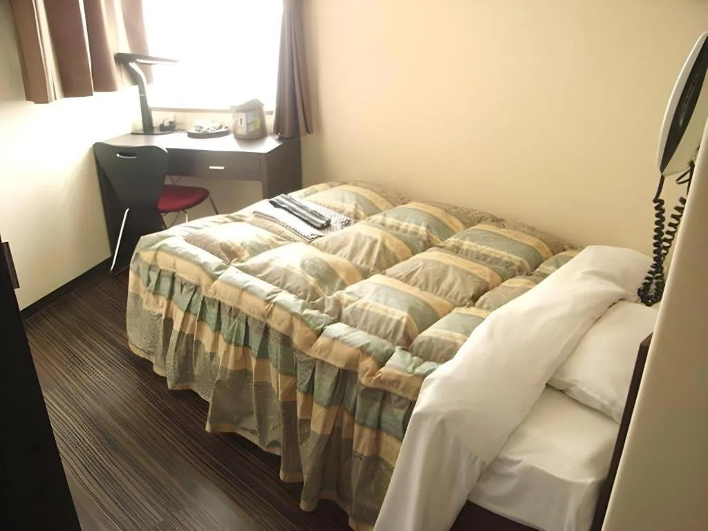 Bed in Mimatsu Hotel
