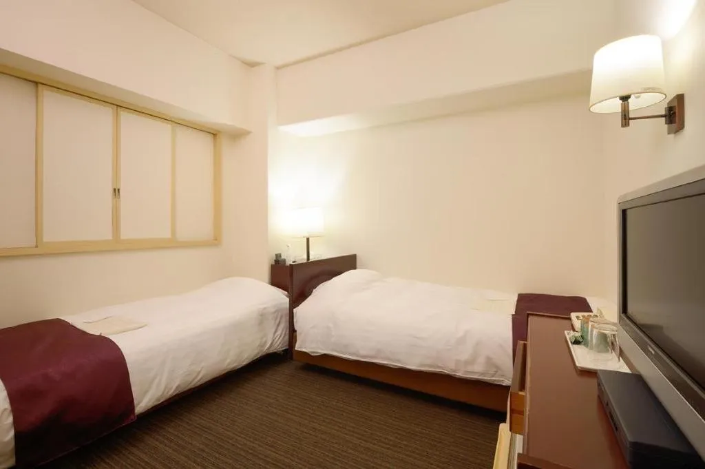 Bed in Ueda Plaza Hotel