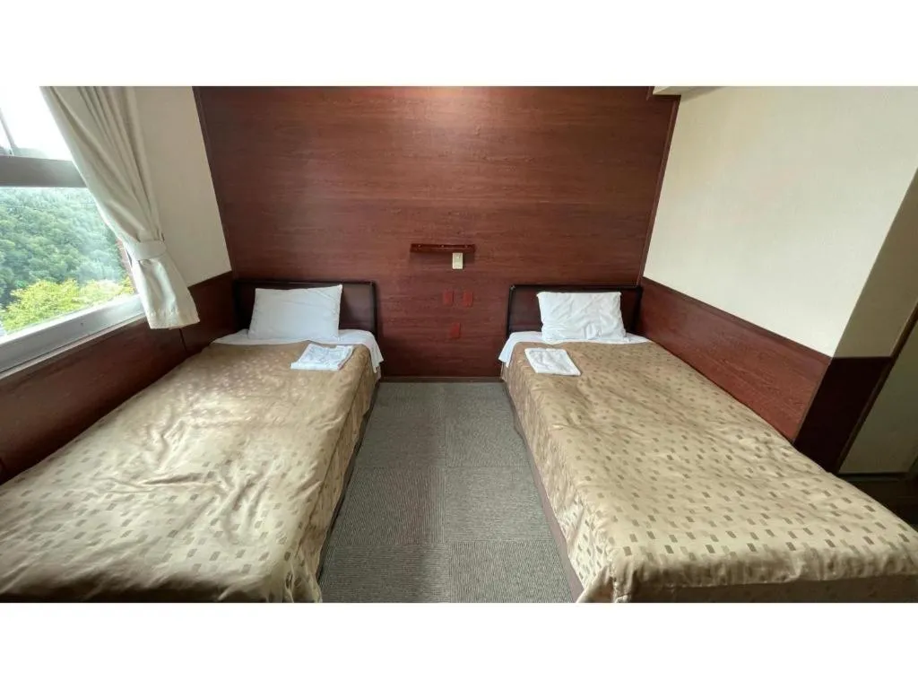 Bed in Fuji Park Hotel