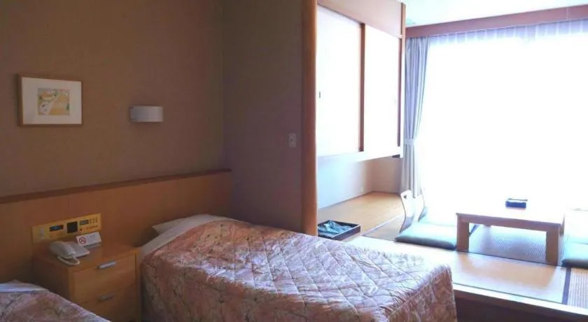 Bed in Sea Side Villa Bokkai