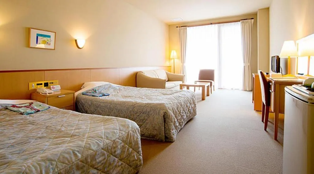 Bed in Sea Side Villa Bokkai