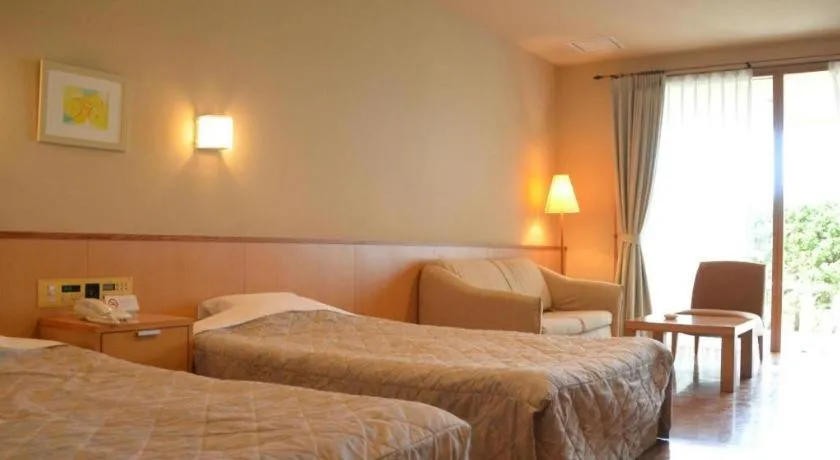 Bed in Sea Side Villa Bokkai