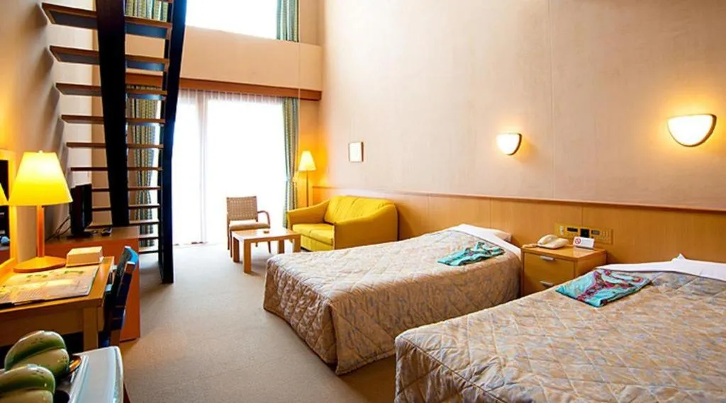 Bed in Sea Side Villa Bokkai