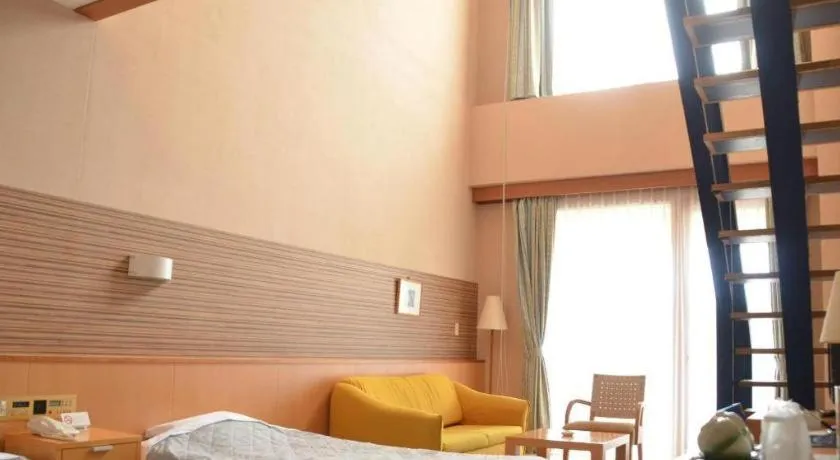 Bed in Sea Side Villa Bokkai