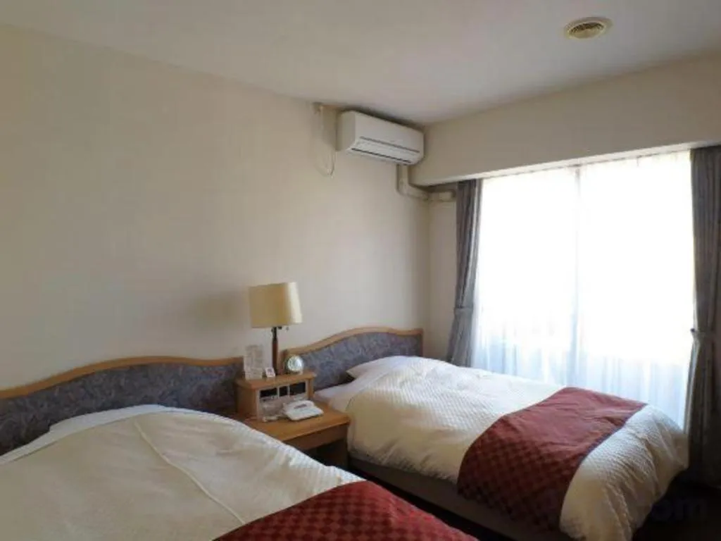 Bed in Hotel Tenchikaku