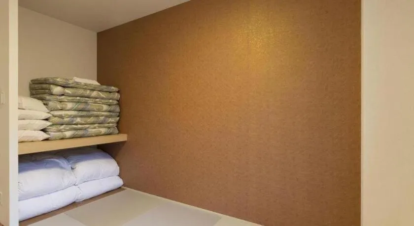 Bed in Daemado Hotel Hitakatsu