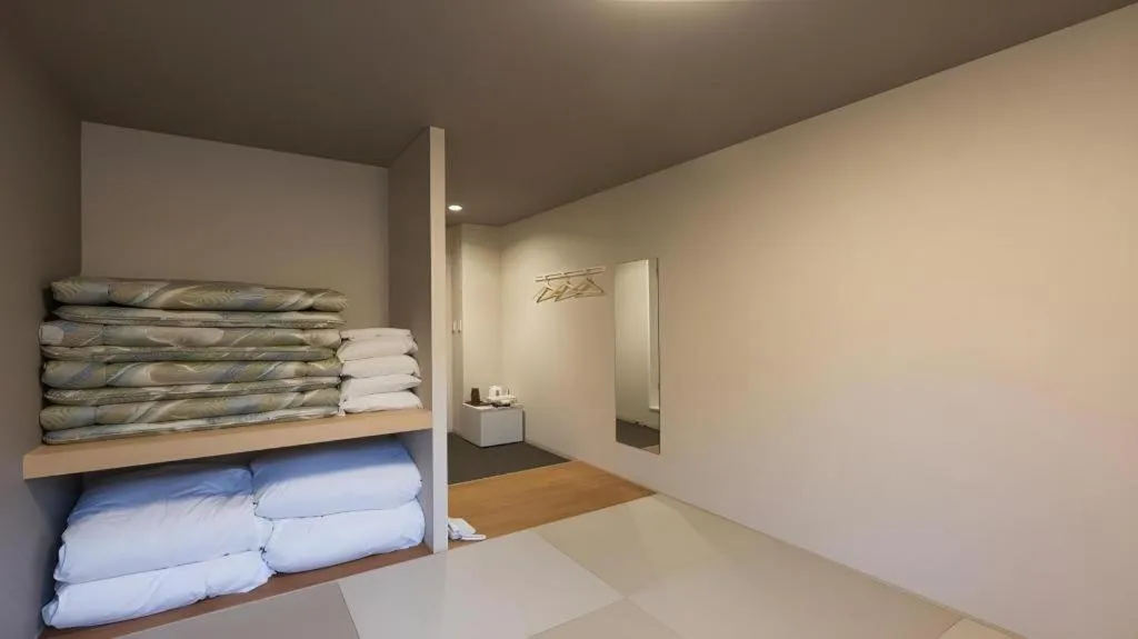 Bed in Daemado Hotel Hitakatsu