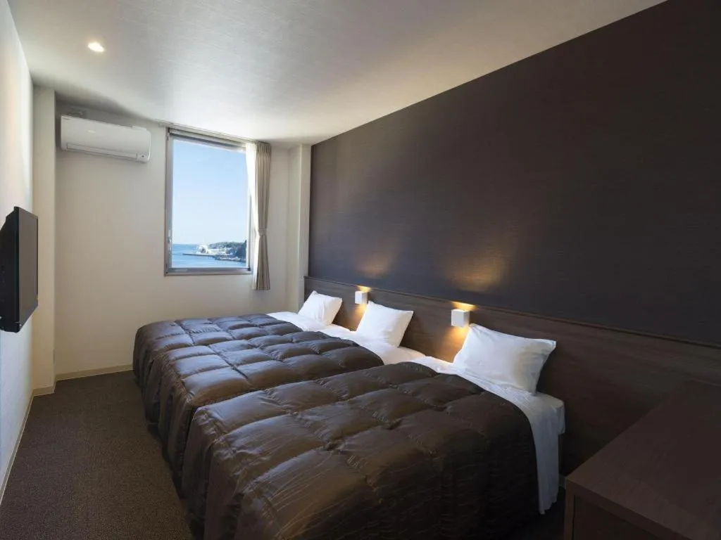 Bed in Daemado Hotel Hitakatsu