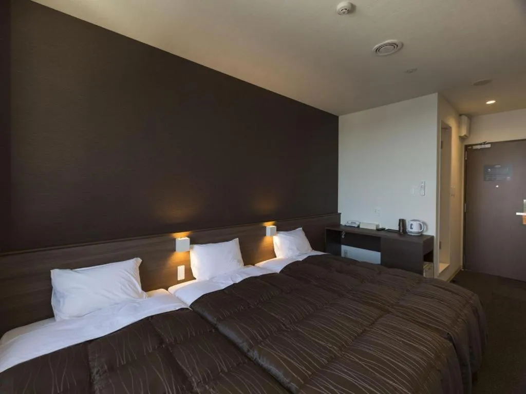 Bed in Daemado Hotel Hitakatsu