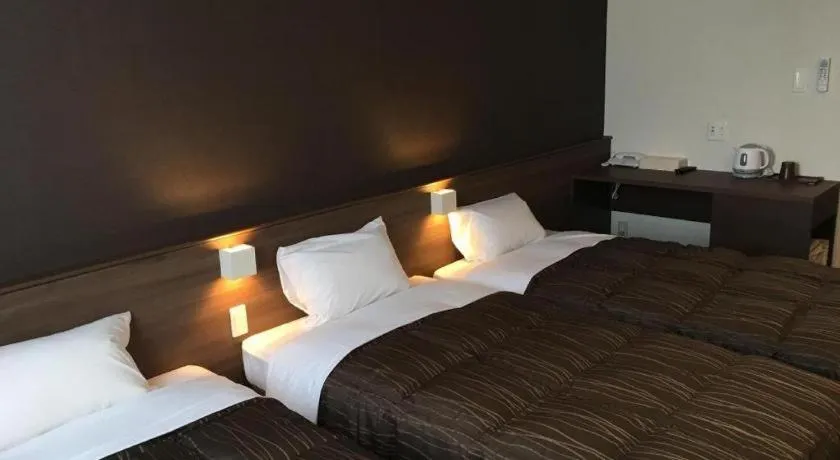 Bed in Daemado Hotel Hitakatsu