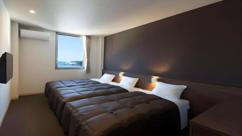 Bed in Daemado Hotel Hitakatsu