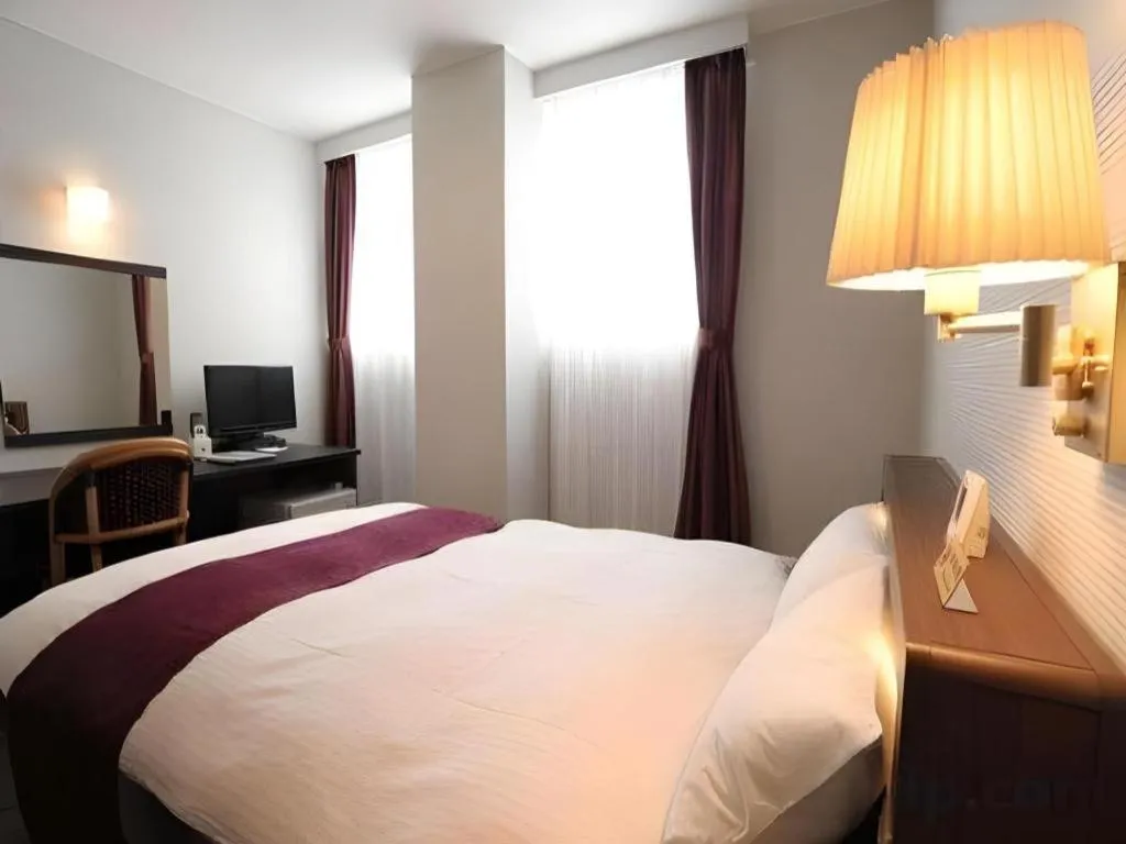 Bed in AKISAWA HOTEL