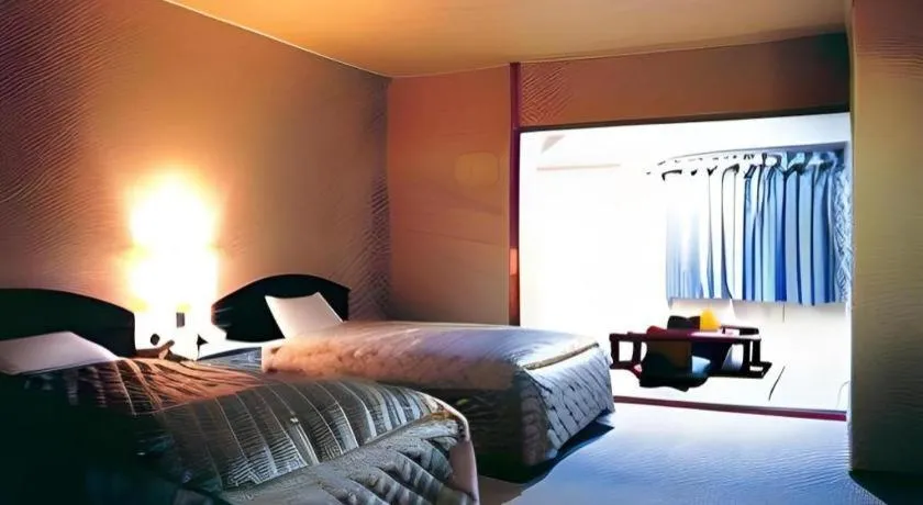 Bed in AKISAWA HOTEL