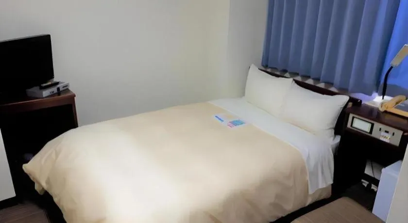 Bed in Hotel Sunshine Iwaki