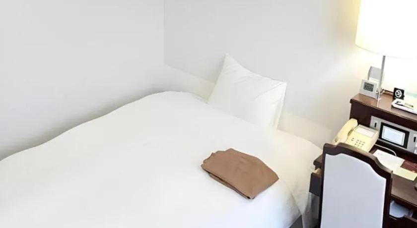 Bed in Hotel Sunshine Iwaki