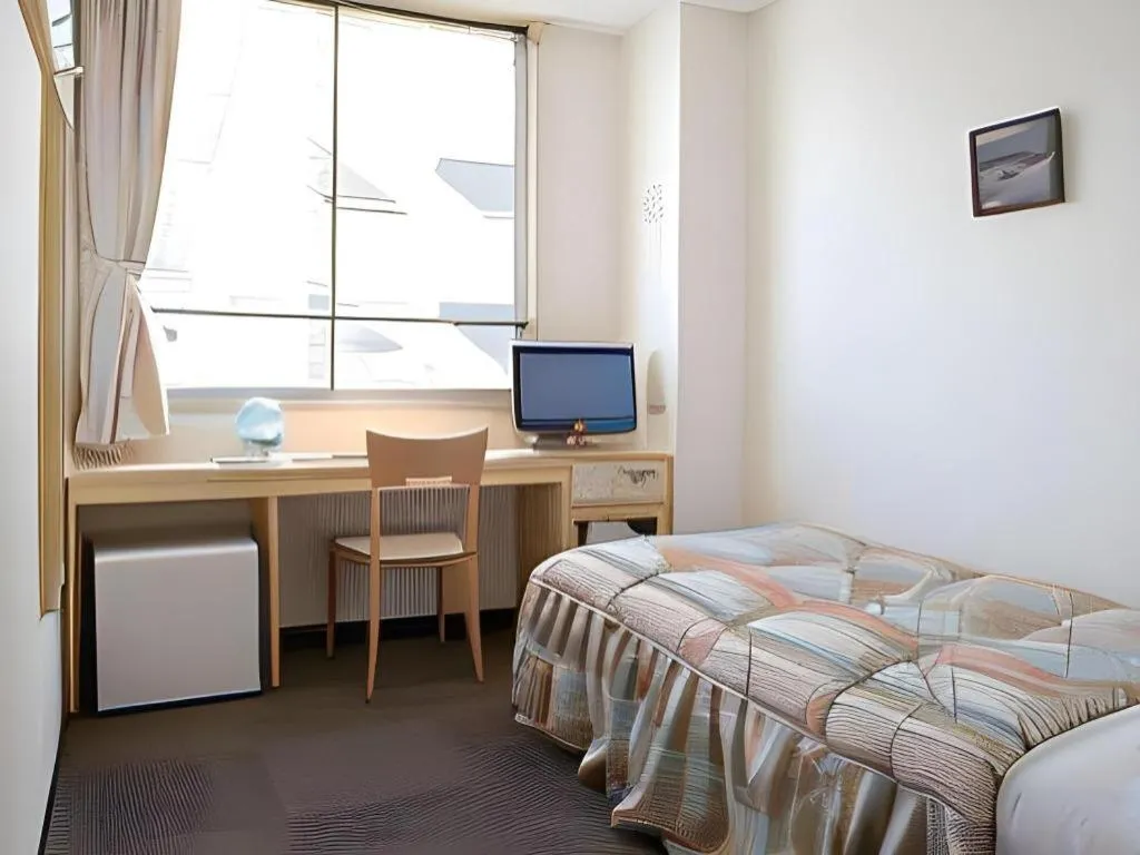 Bed in Hotel Sunshine Iwaki