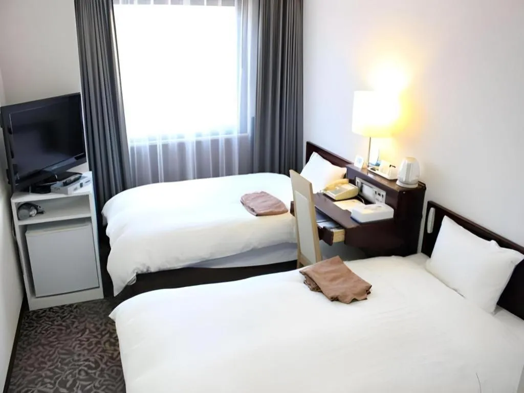 Bed in Hotel Sunshine Iwaki