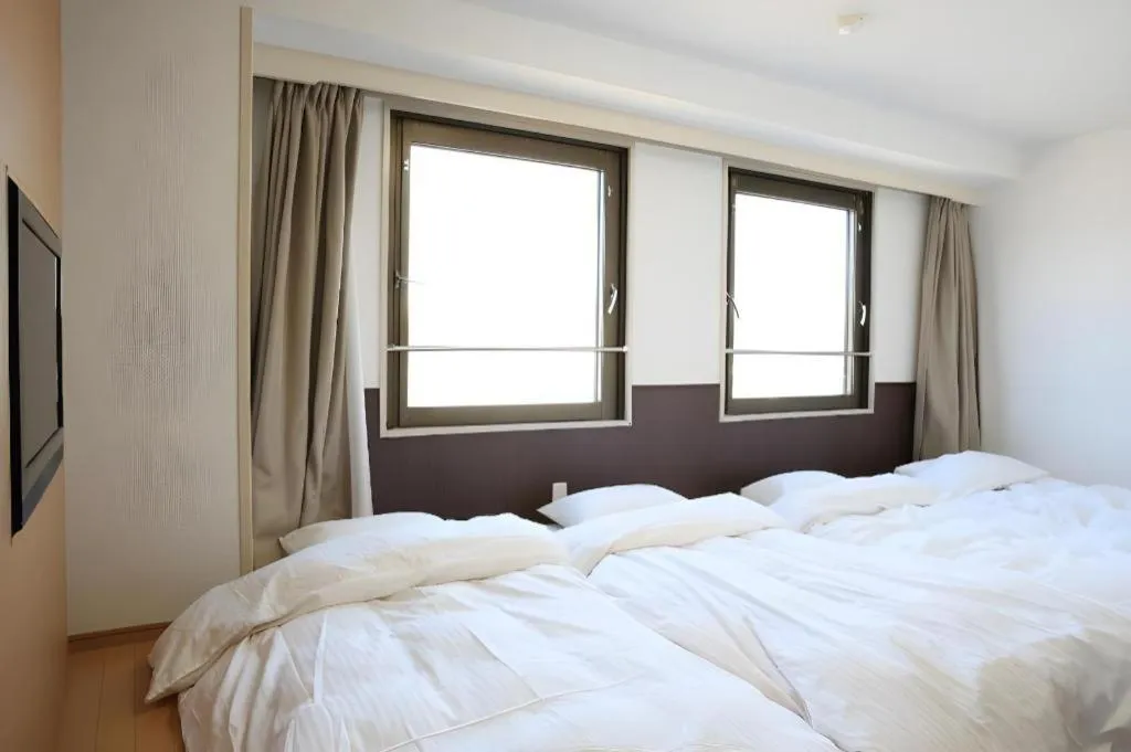 Bed in Hotel Sunshine Iwaki