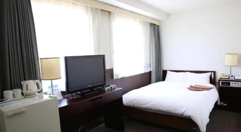 Bed in Hotel Sunshine Iwaki