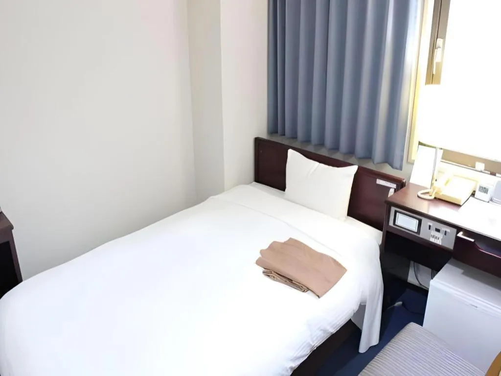 Bed in Hotel Sunshine Iwaki