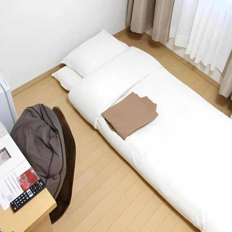 Bed in Hotel Sunshine Iwaki