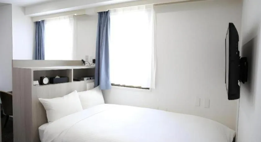 Bed in Hotel Sunshine Iwaki