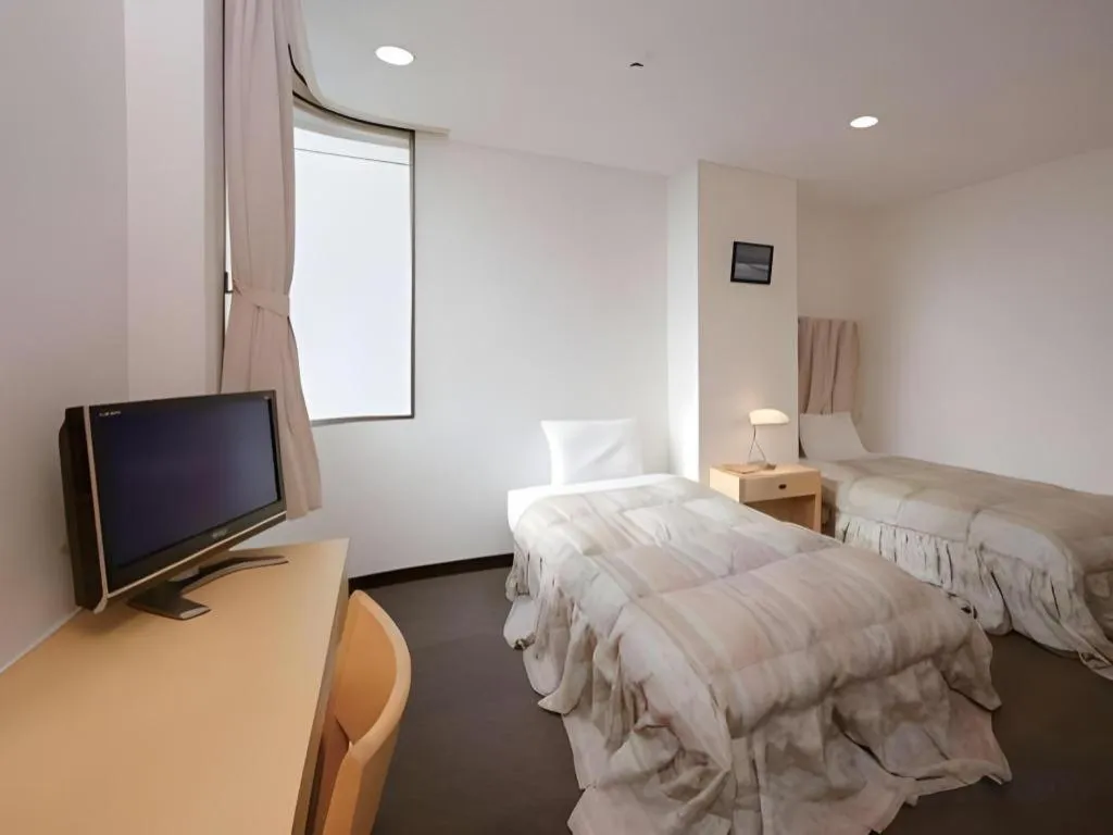 Bed in Hotel Sunshine Iwaki