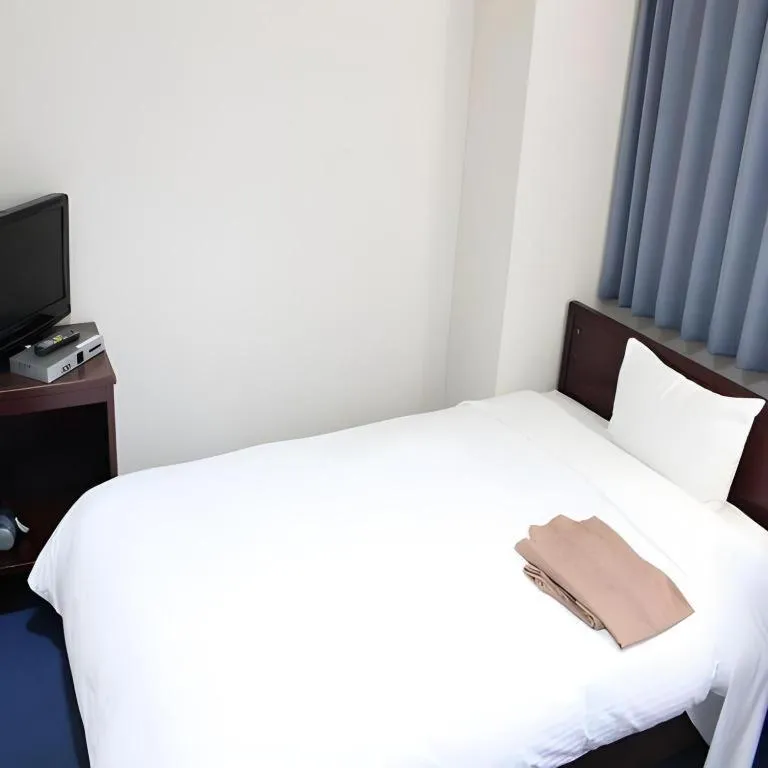 Bed in Hotel Sunshine Iwaki